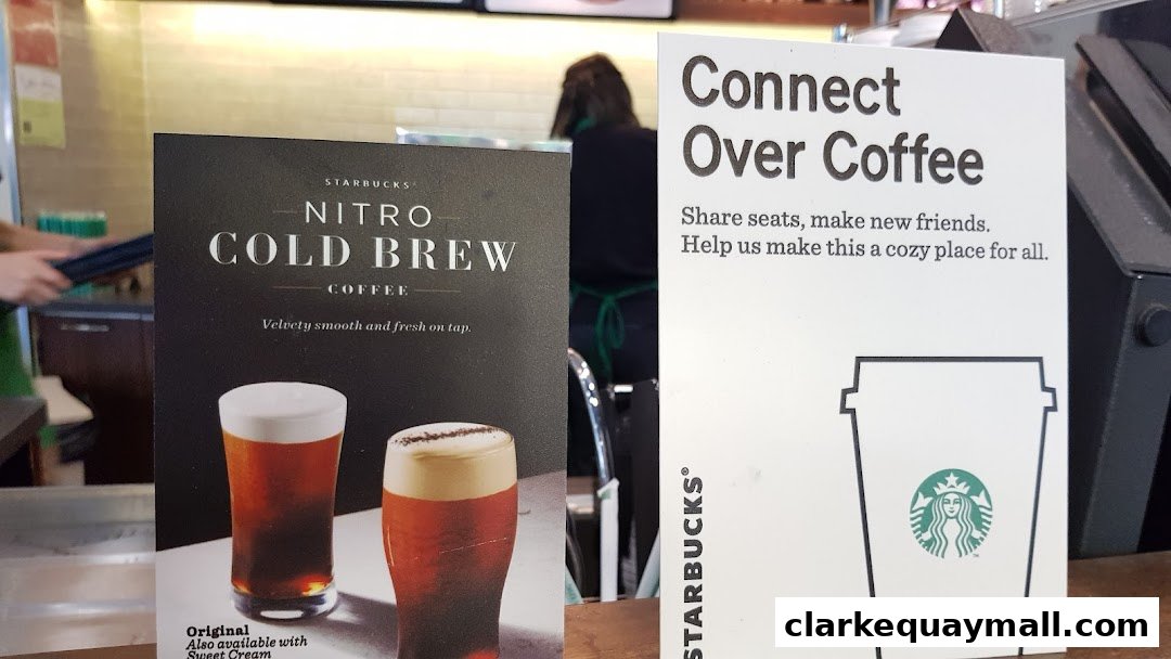 Starbucks signs promoting Nitro Cold Brew coffee and a cozy atmosphere.