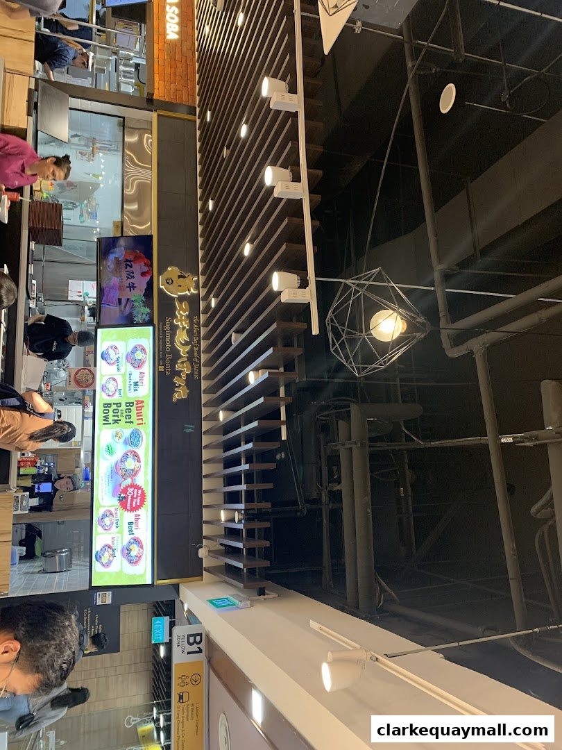 A view of the Sugimoto Bonta restaurant with a menu display and interior decor.