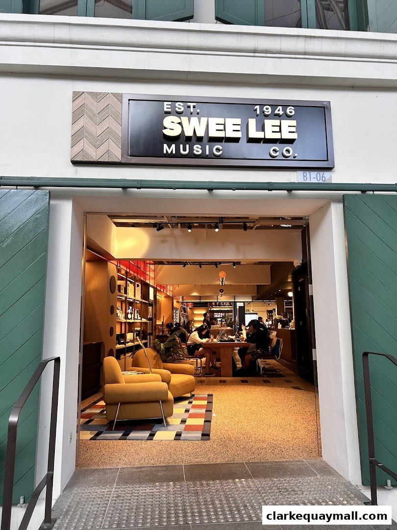 The entrance to Swee Lee Music Co. featuring a sign and a glimpse of the interior.