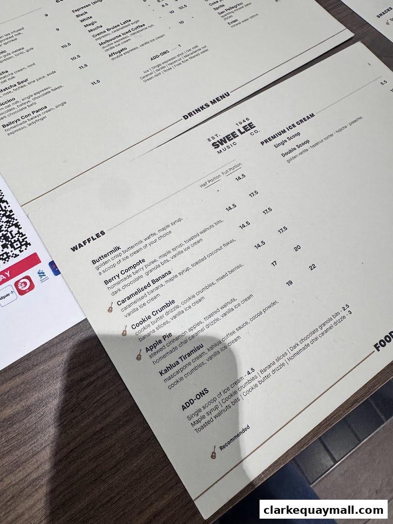 A menu from Swee Lee Music Co. featuring waffles, premium ice cream, and drinks.