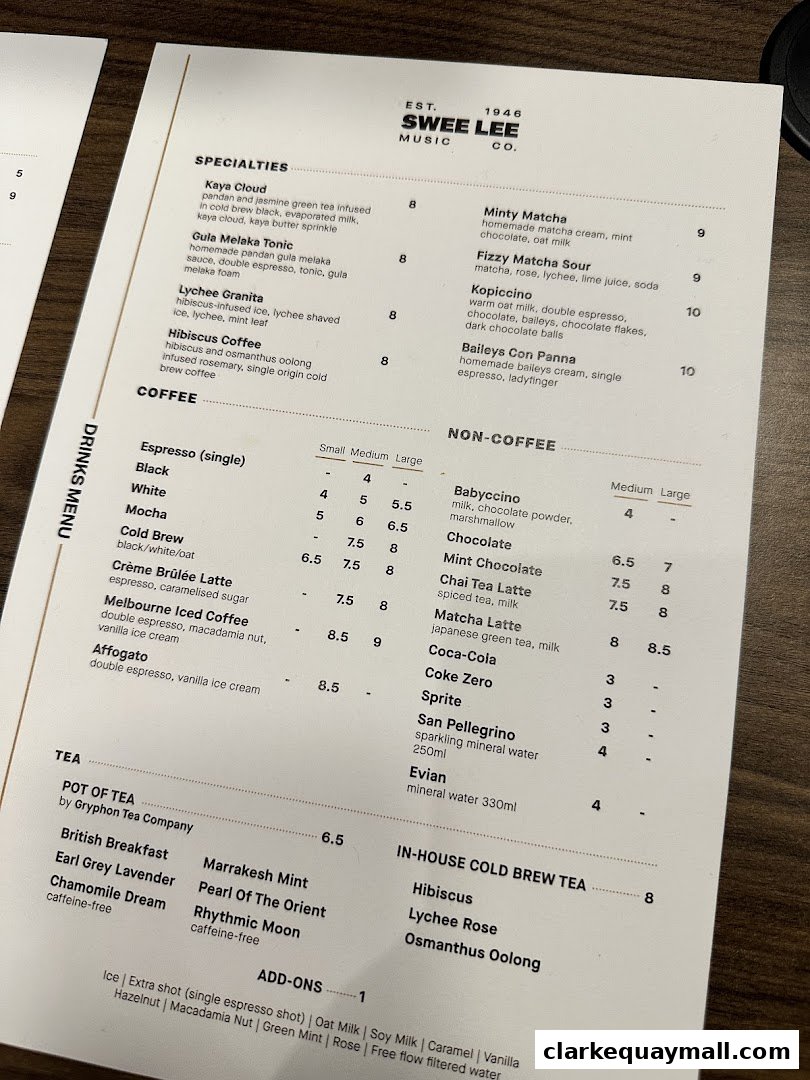 A menu from Swee Lee Music Co. featuring specialty drinks, coffee, tea, and non-coffee beverages.