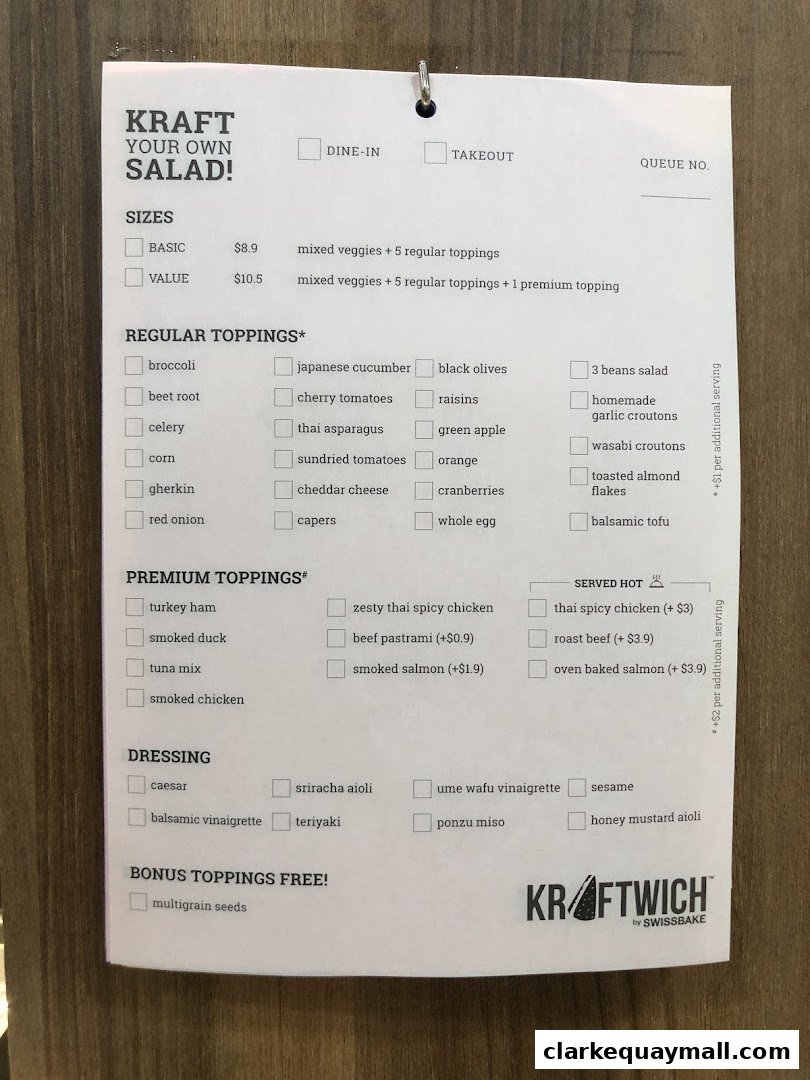 A menu for creating your own salad with various topping and dressing options.
