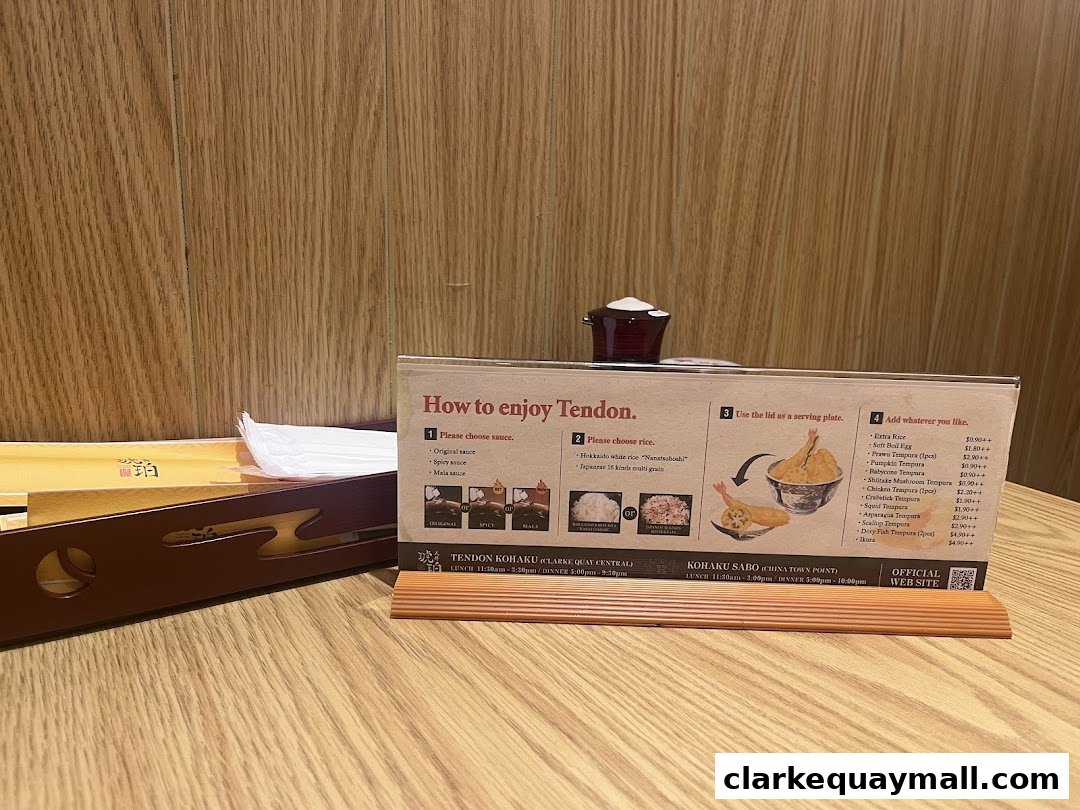 A table setting at Tendon Kohaku with a menu explaining how to enjoy Tendon.
