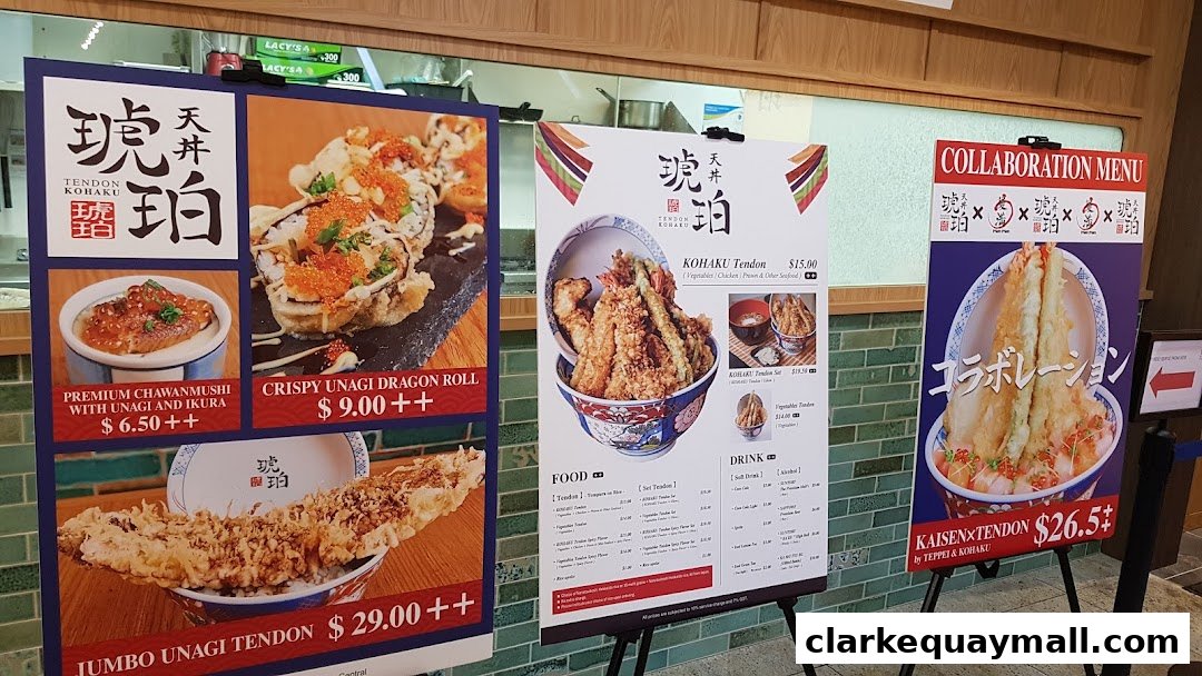 A display of menus and food items from Tendon Kohaku, showcasing various tendon dishes and sushi.