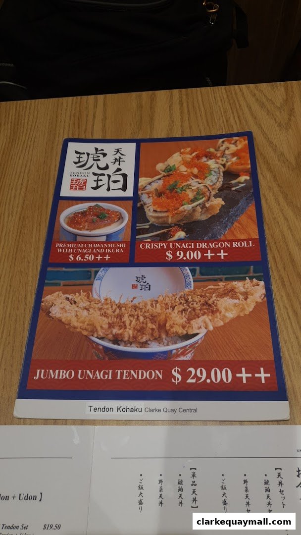 A menu from Tendon Kohaku featuring Unagi dishes and sushi rolls.