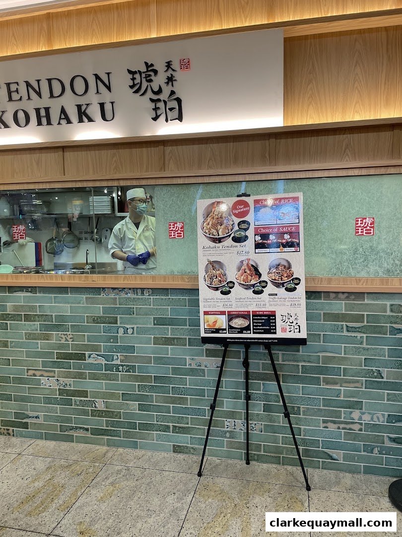 A menu board outside Tendon Kohaku, showcasing various tendon sets and their prices.