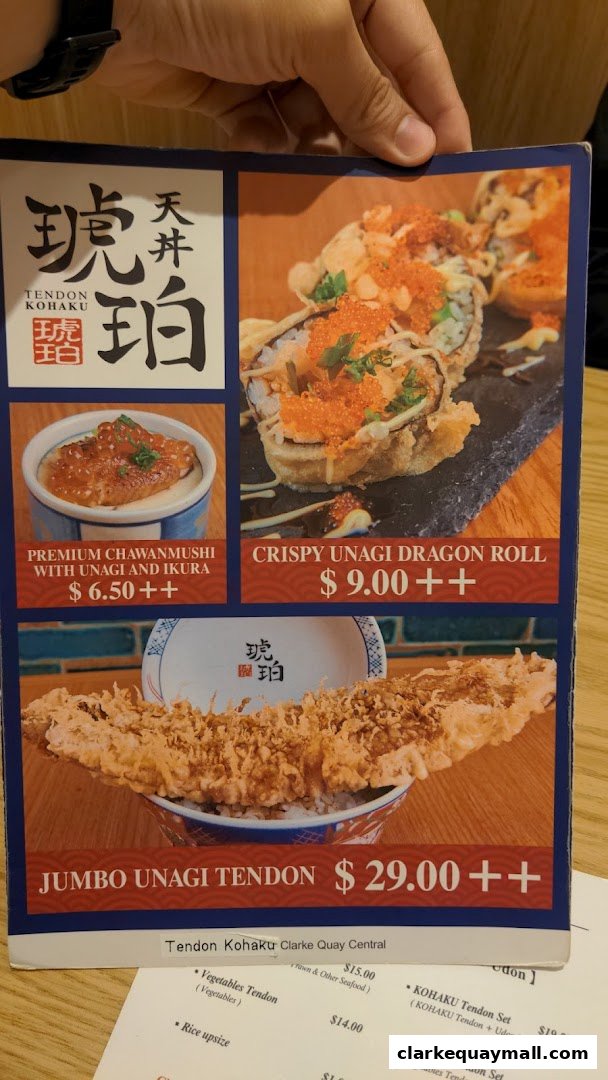 A menu from Tendon Kohaku featuring premium Japanese dishes like Unagi Tendon and sushi rolls.
