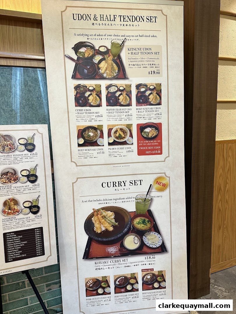 A menu board showcasing Udon and Tendon sets, including curry options.