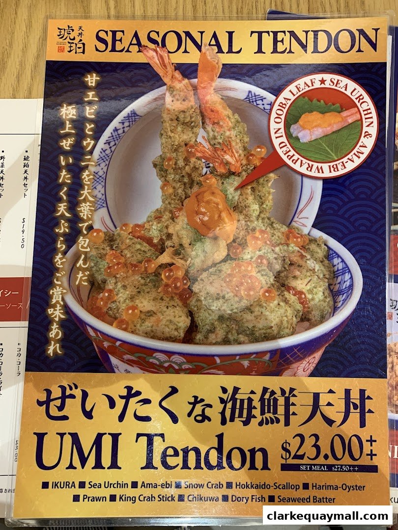 A close-up of a menu featuring a 'Seasonal Tendon' dish with shrimp and roe.