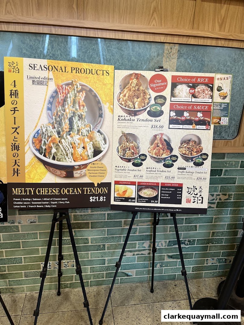 A menu display featuring various tendon dishes, including a seasonal 'Melty Cheese Ocean Tendon'.