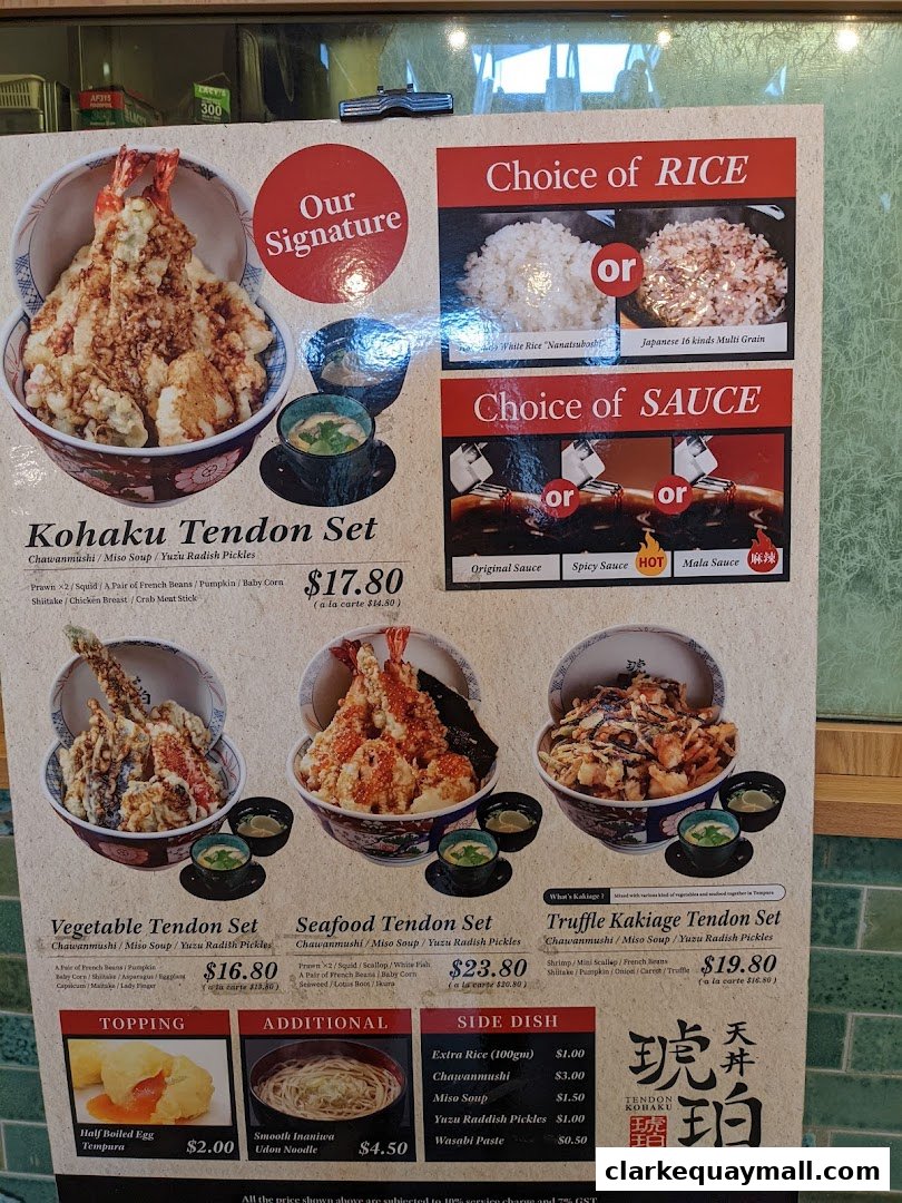A menu board for Tendon Kohaku, showcasing various tendon sets, rice and sauce choices, and side dishes.