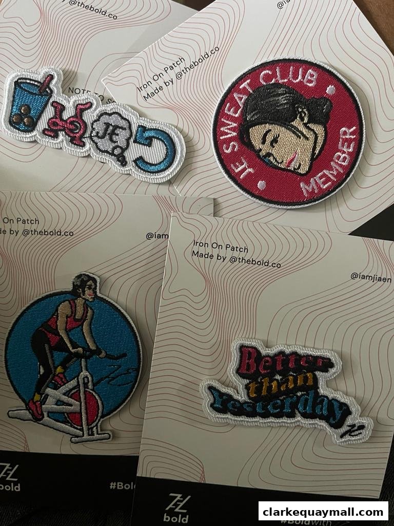 A collection of four embroidered iron-on patches with fitness and lifestyle themes.