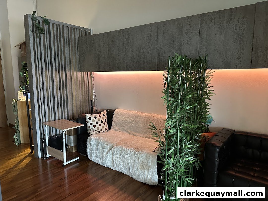 A modern waiting area with comfortable seating, decorative plants, and ambient lighting.