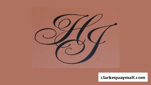 A close-up of the elegant 'HG' monogram logo for The Hengs Jewellery.