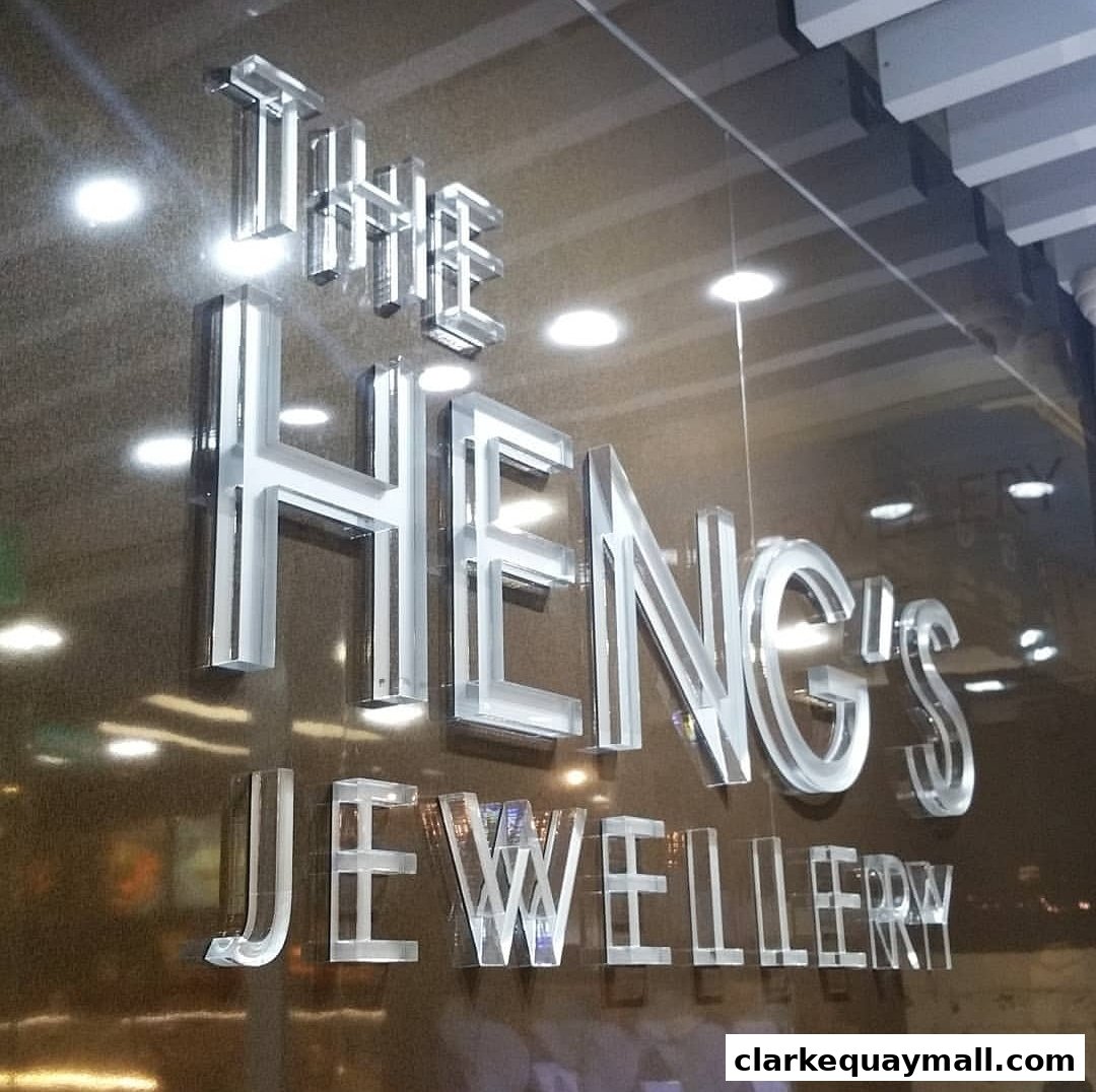 The Heng's Jewellery shop name displayed in clear, raised lettering on a dark, reflective surface.