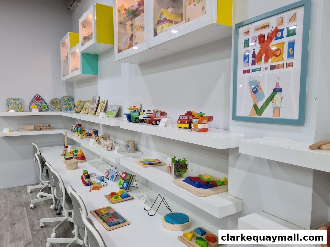 Interior view of a toy store with shelves displaying various wooden toys and puzzles.