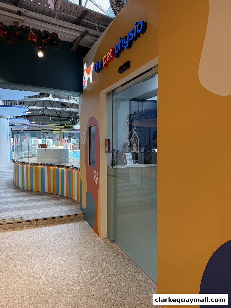 The entrance to 'The Pet Physio' shop with a colorful exterior and signage.