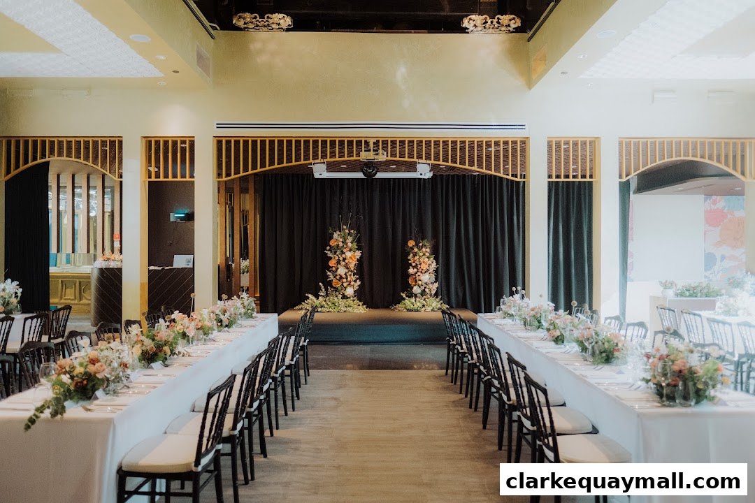 A beautifully set long dining table with floral arrangements, ready for an event.