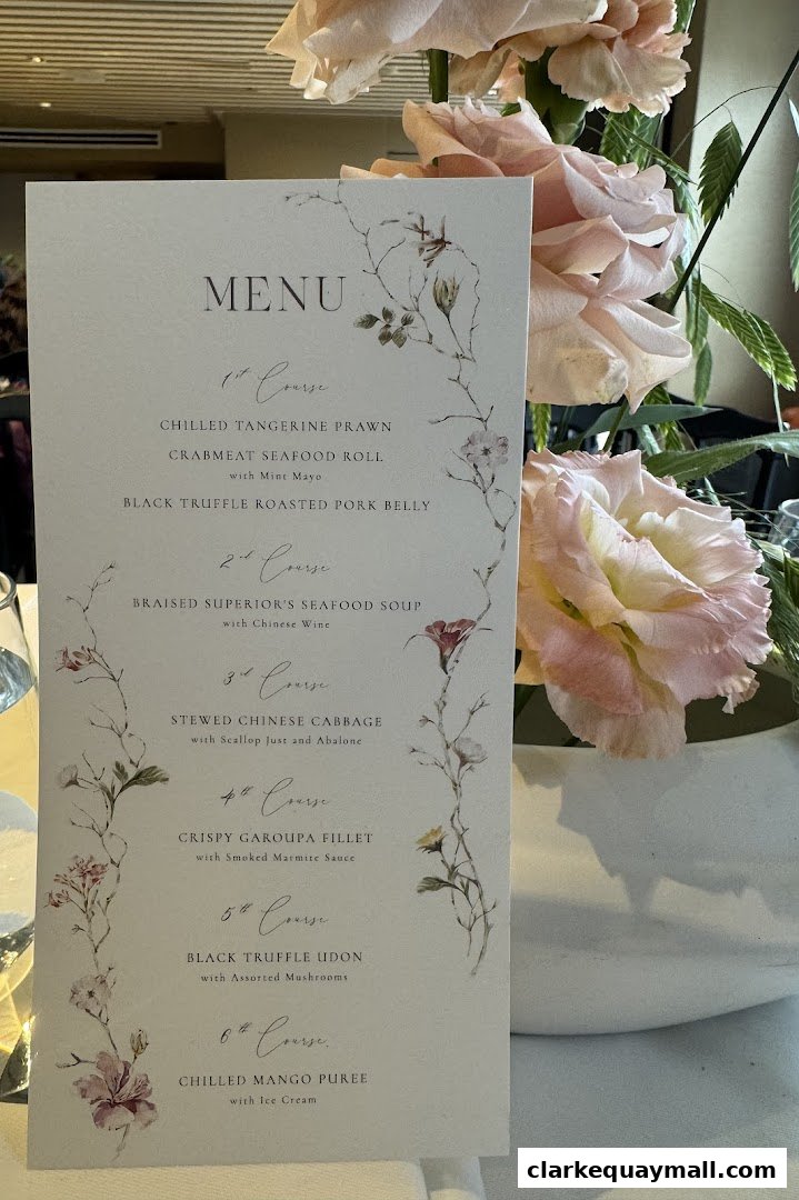 A menu from The Riverhouse Singapore with a floral design, featuring a six-course meal.