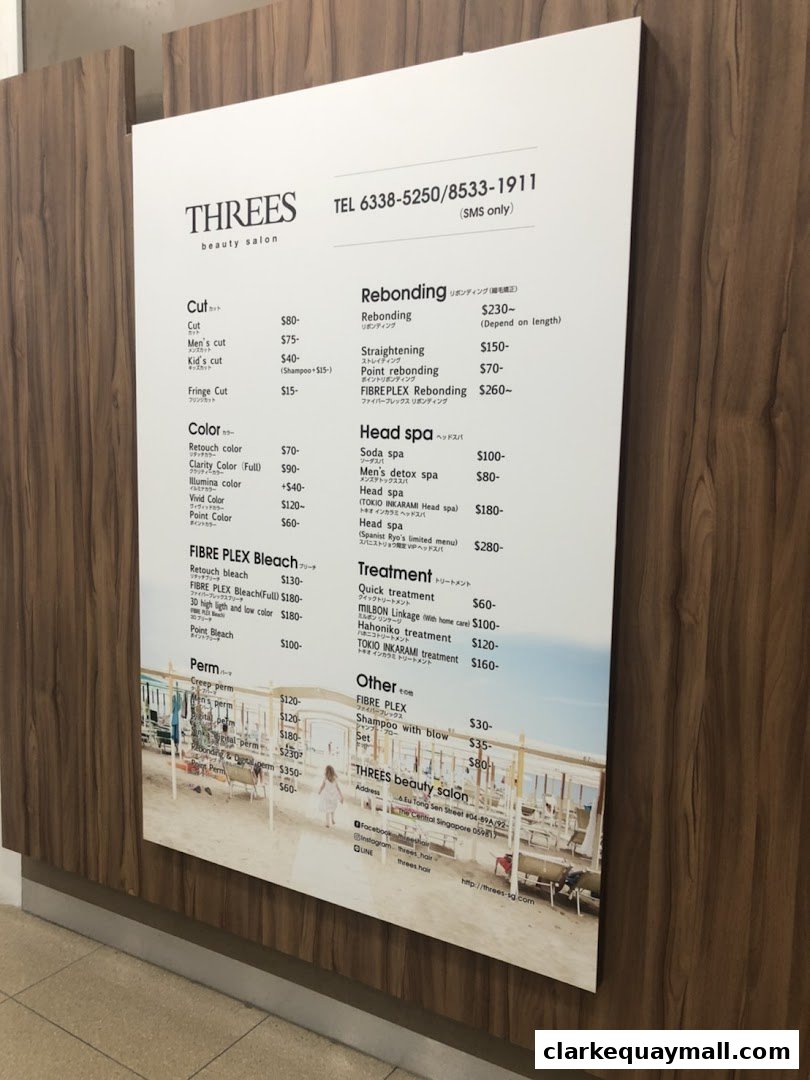 A menu board for THREES Beauty Salon displaying various hair services and prices.
