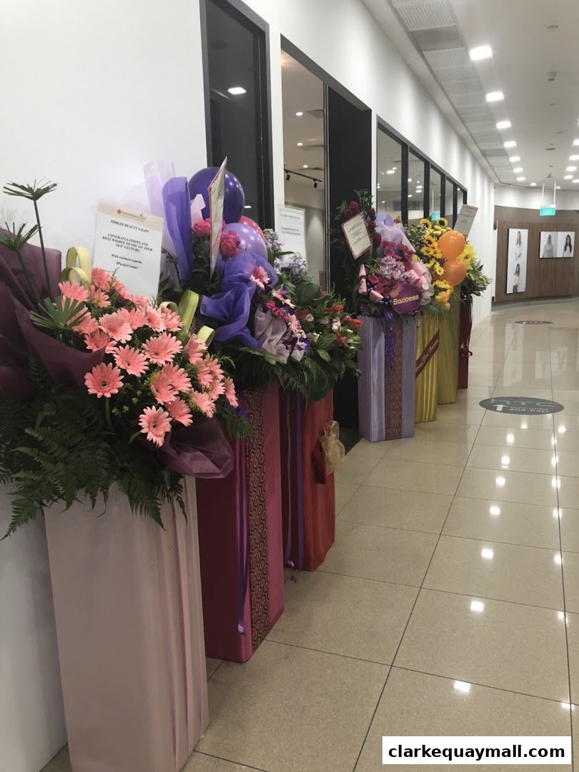 Flower stands and balloons outside a salon, celebrating a new opening.