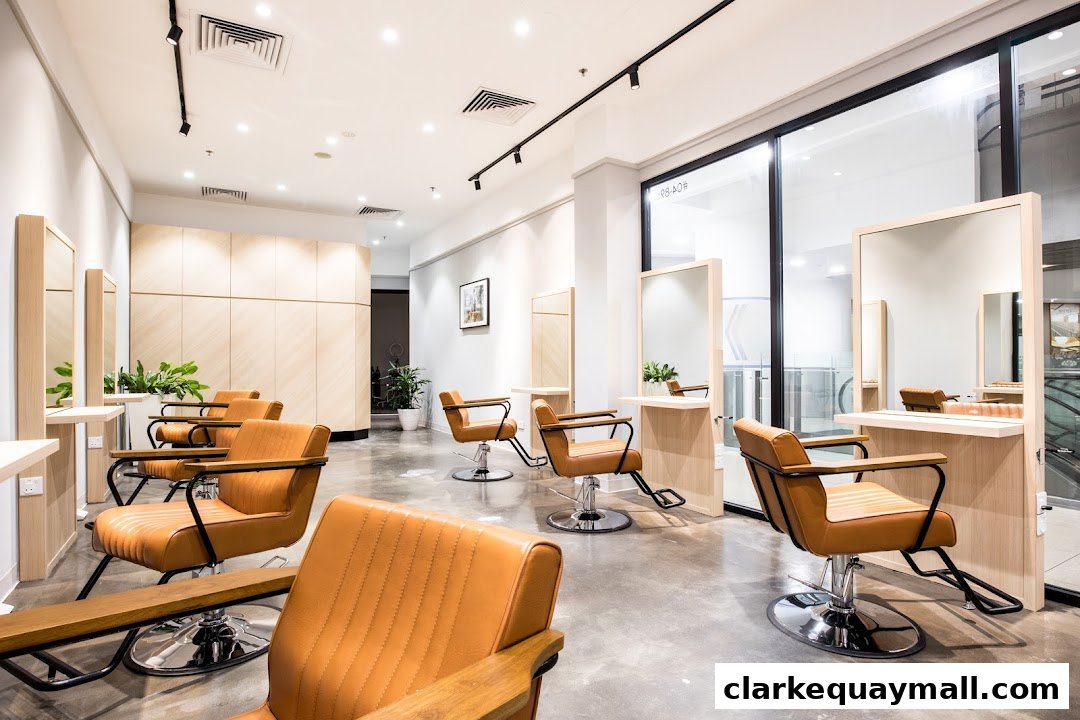 Interior of a modern beauty salon with stylish tan chairs and mirrors.