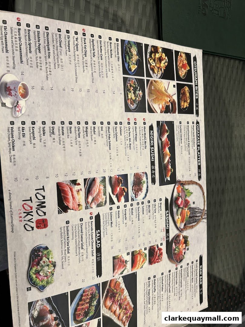 A menu from Tomo Tokyo featuring various Japanese dishes like sushi, sashimi, and appetizers.