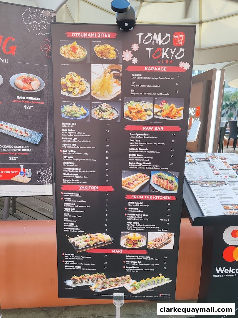 A menu board for Tomo Tokyo restaurant, showcasing various Japanese dishes with images and prices.