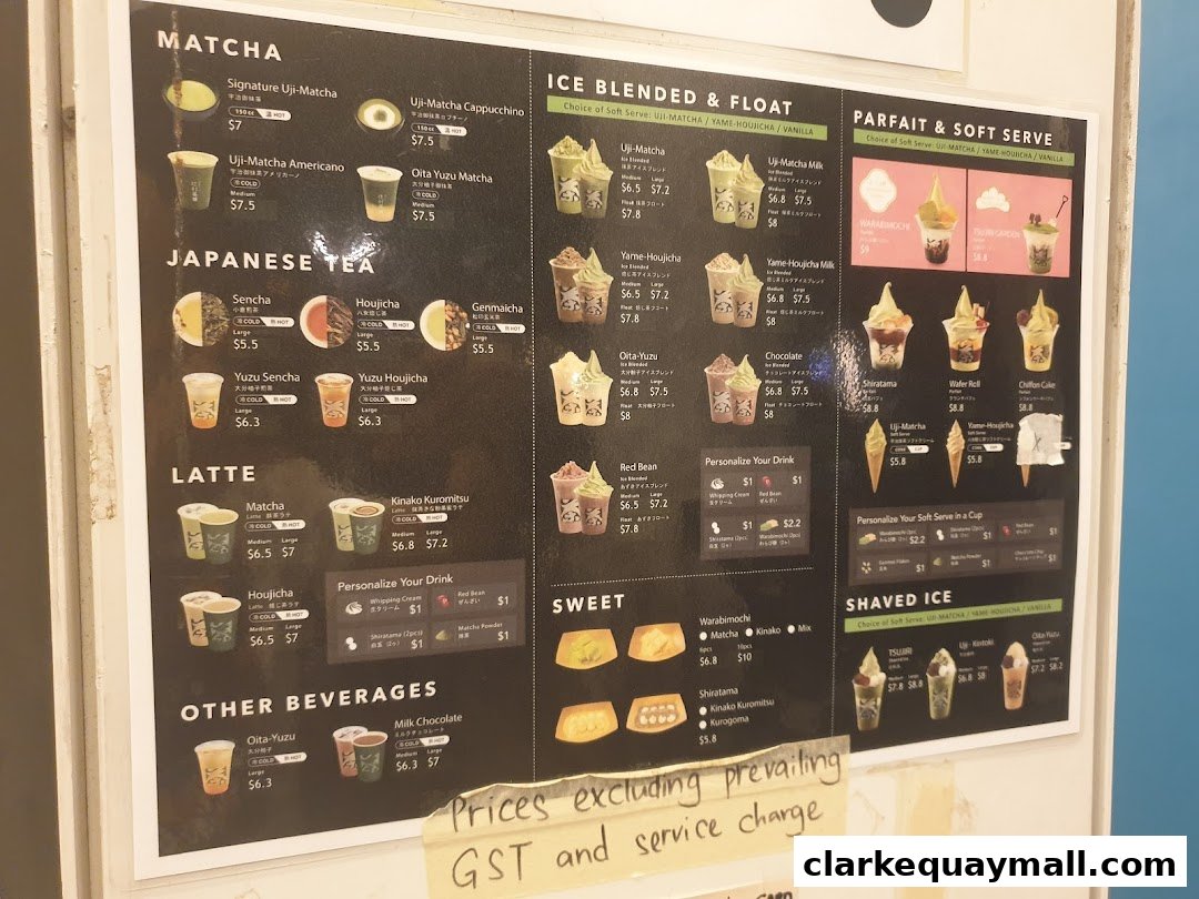 A menu board displaying various matcha, Japanese tea, latte, and dessert items with prices.