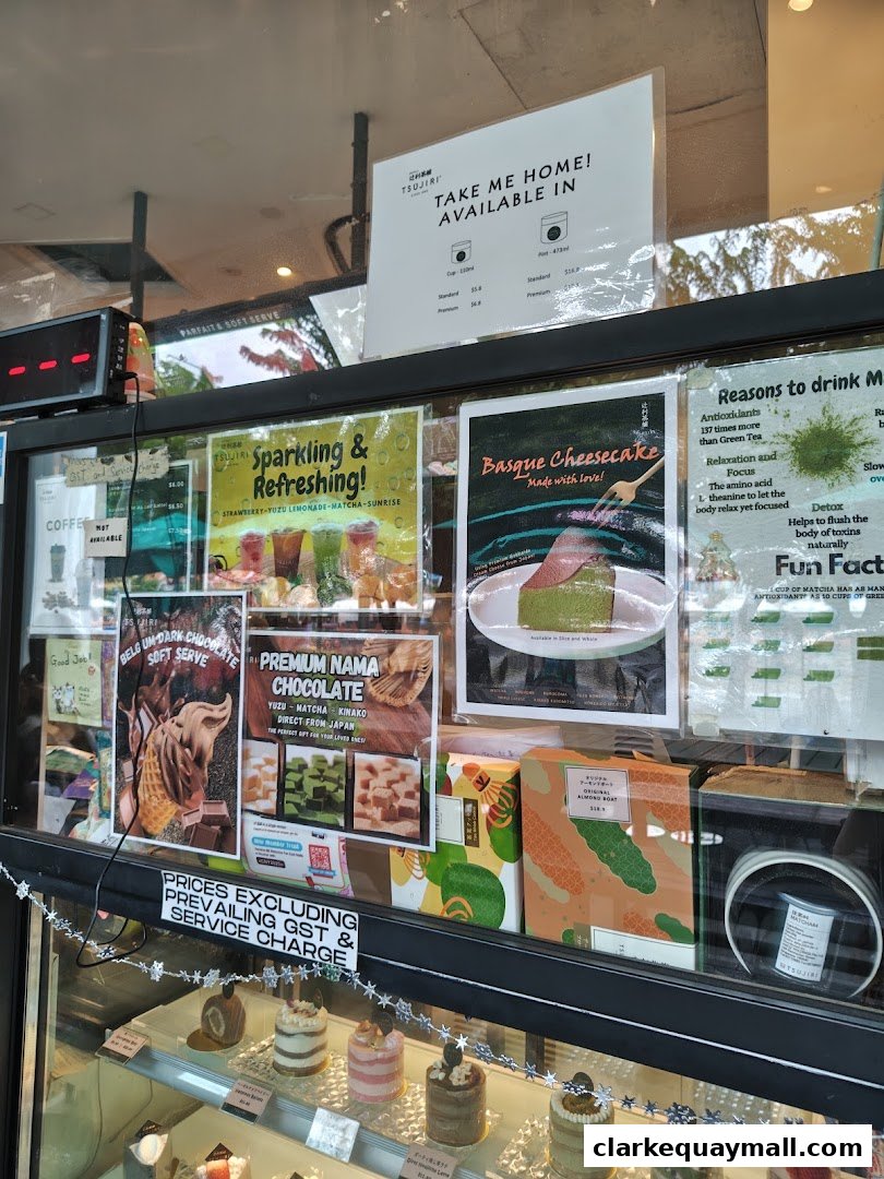 A shop window displaying various desserts, drinks, and packaged goods from TSUJIRI.