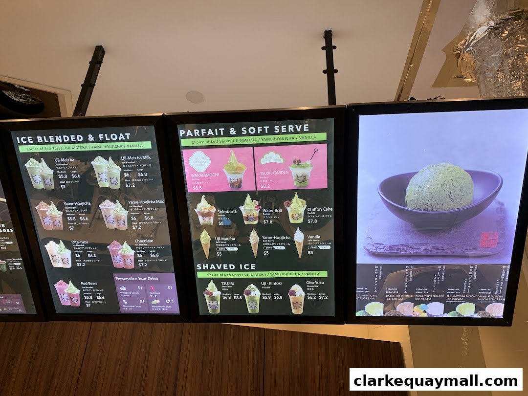 A digital menu board displaying various ice cream and dessert options with prices.