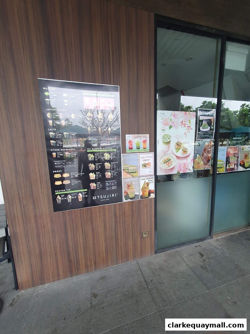 A menu board and storefront displays for TSUJIRI The Central Store, featuring matcha desserts and drinks.