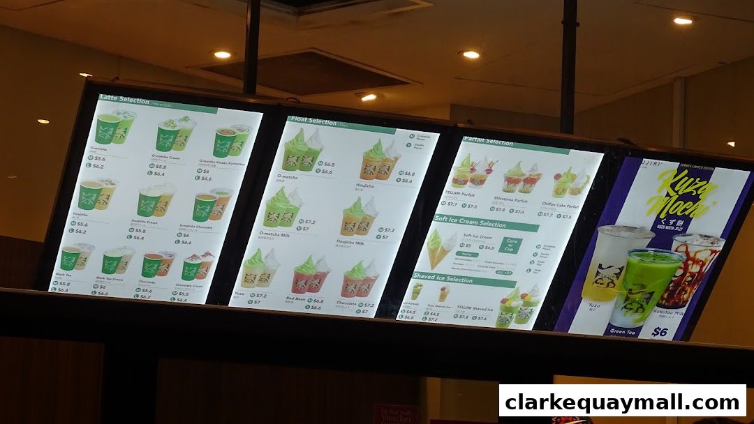 A brightly lit menu board displaying various matcha-based drinks, parfaits, and soft-serve ice cream.