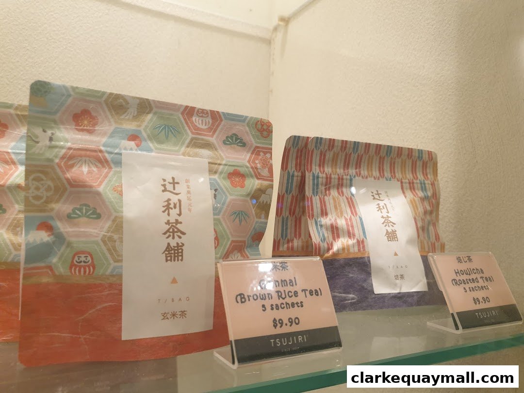 Packaged teas with Japanese designs and prices displayed on shelves.