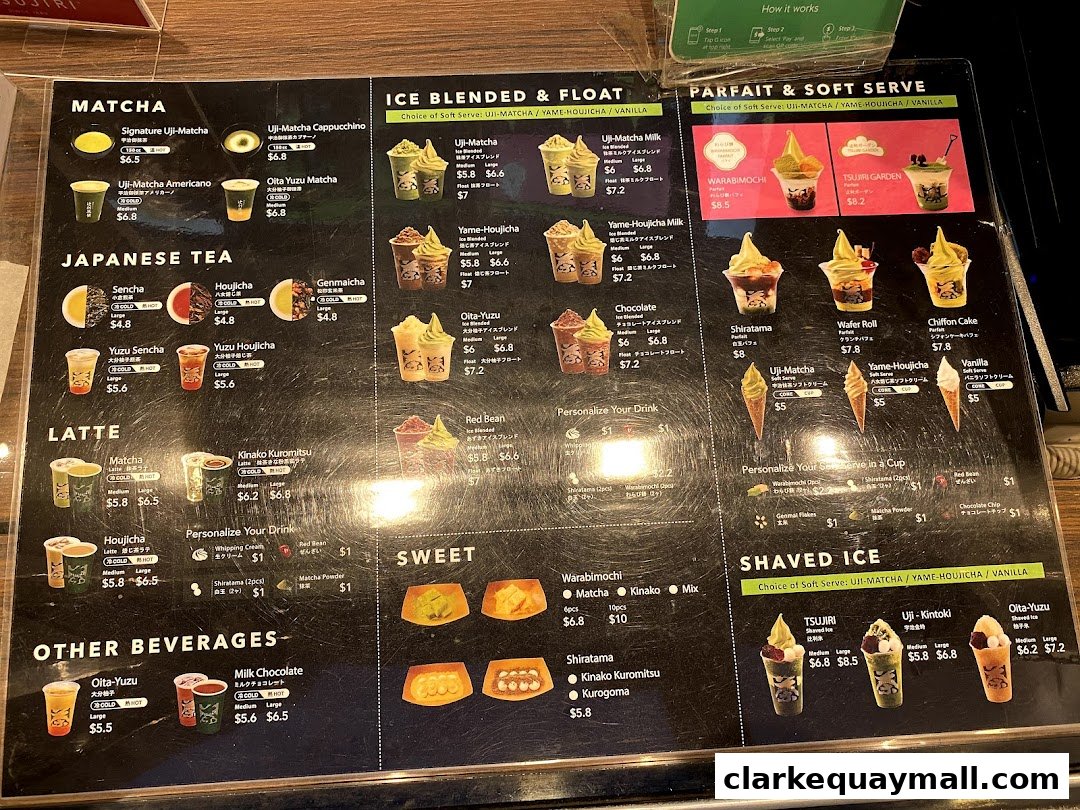 A menu board displaying various matcha, tea, latte, parfait, and shaved ice desserts and drinks.