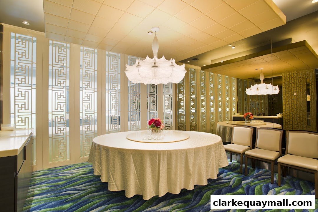 Elegant dining room with round tables, chairs, and decorative screens.