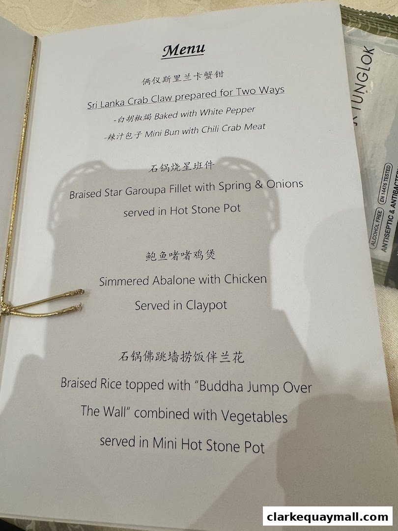 A menu from TungLok Signatures featuring Sri Lanka Crab Claw and Braised Star Garoupa.