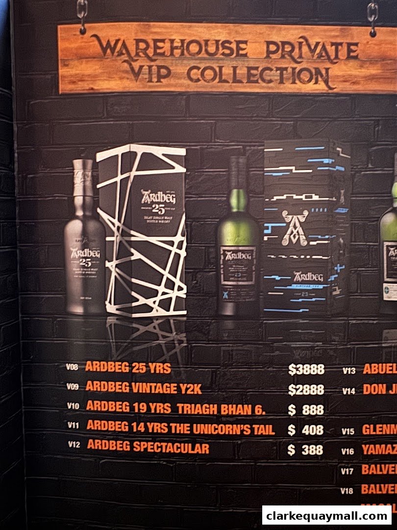 A display of Ardbeg whiskies with their names and prices, under a VIP Collection sign.