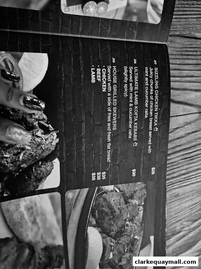 A menu page from Warehouse Bar featuring grilled skewers and chicken tikka.