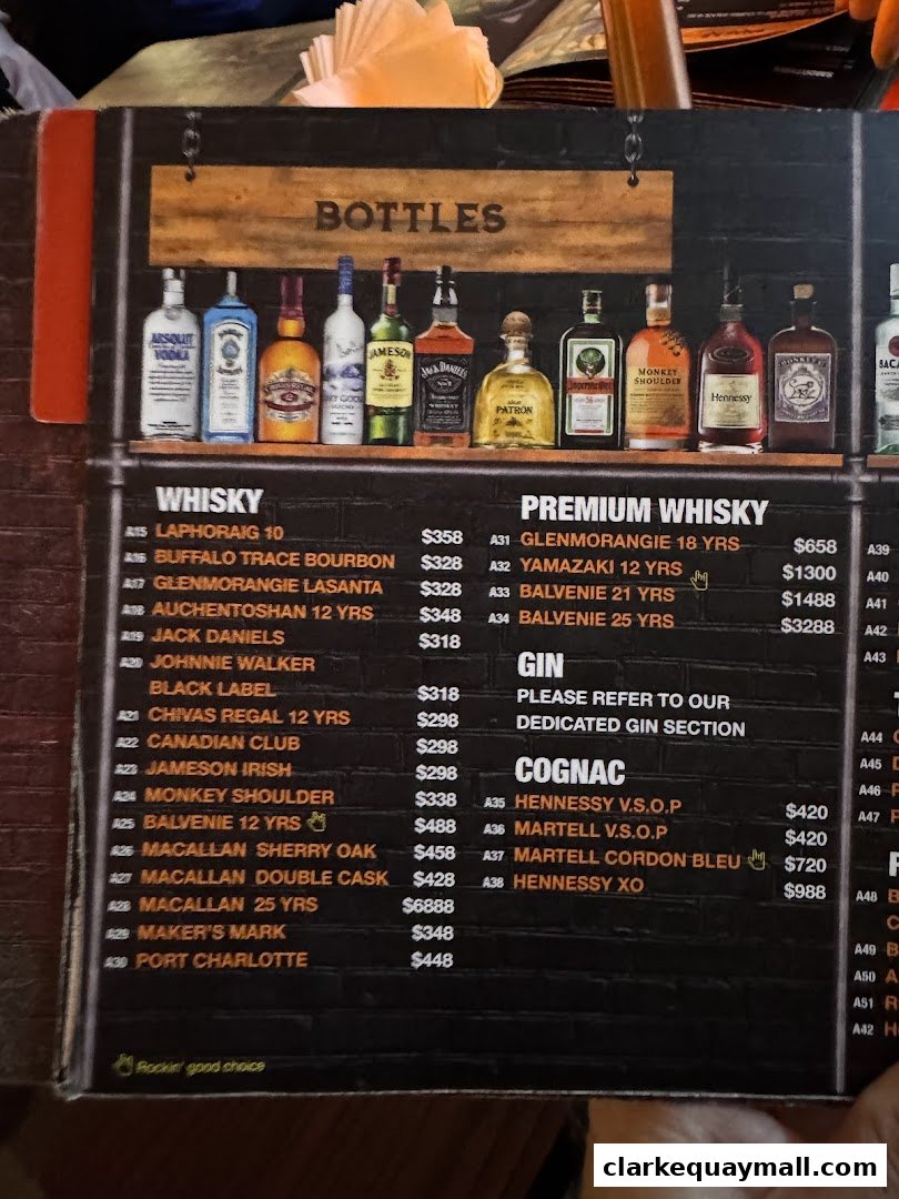 A menu page displaying various bottles of whisky, gin, and cognac with prices.