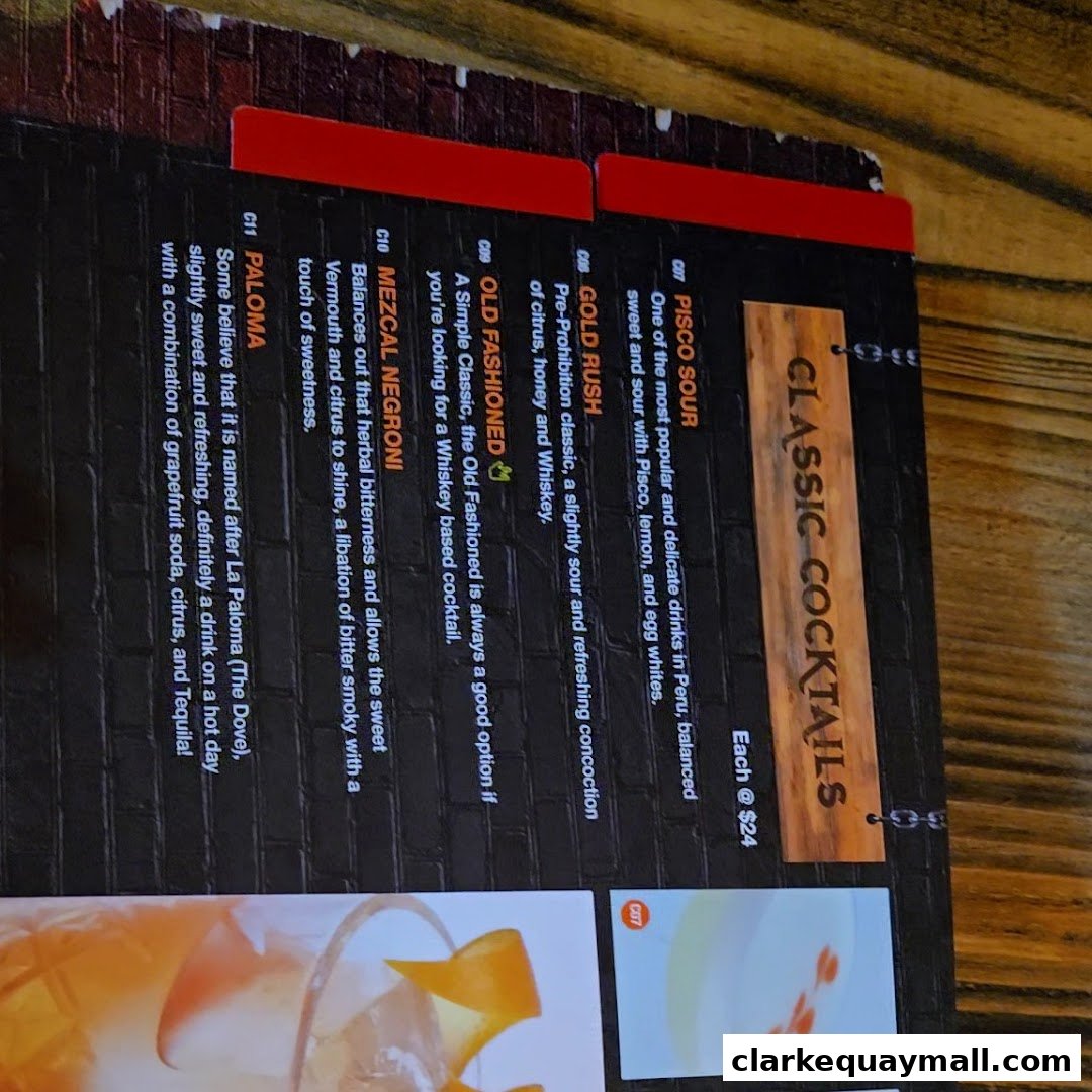 A menu featuring classic cocktails with descriptions and prices.