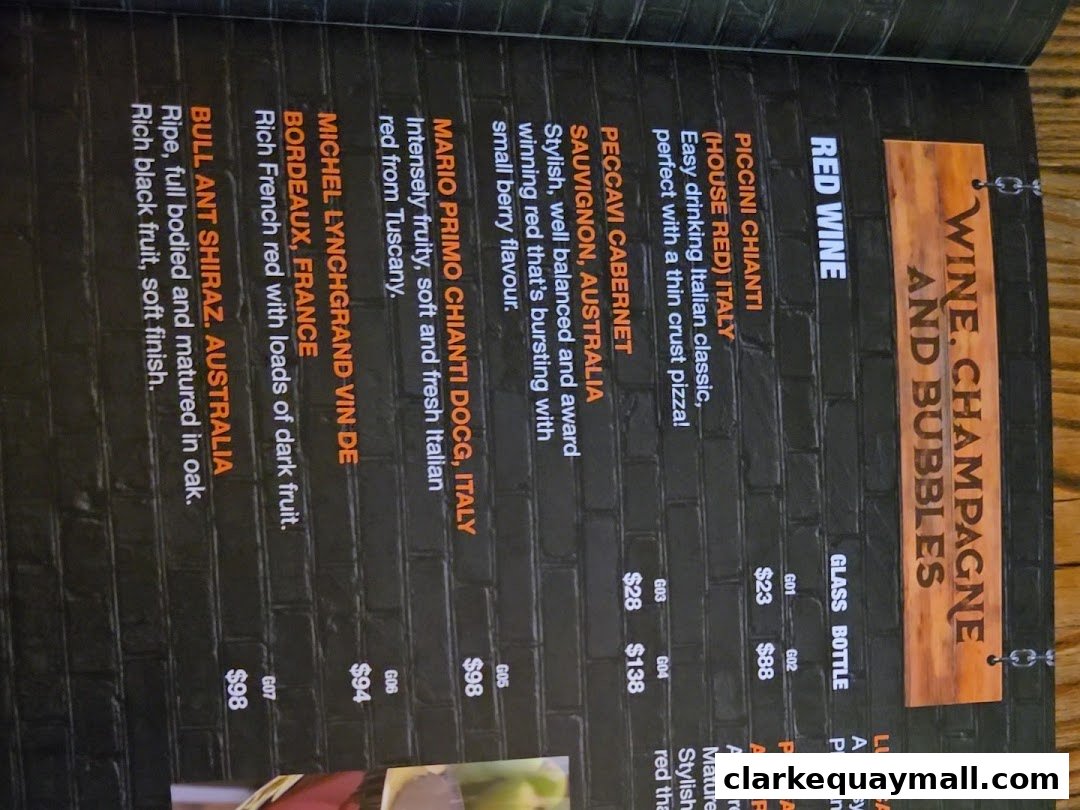 A menu page featuring red wines, with descriptions and prices.