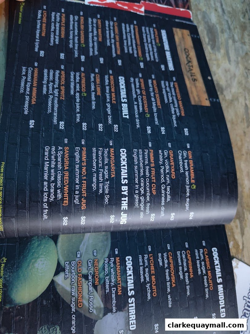 A menu featuring various cocktails with prices and descriptions.