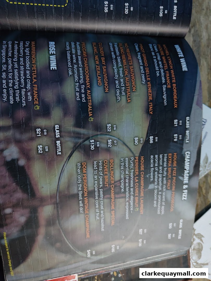A menu page featuring a selection of white wines, champagne, and rosé wine with prices.