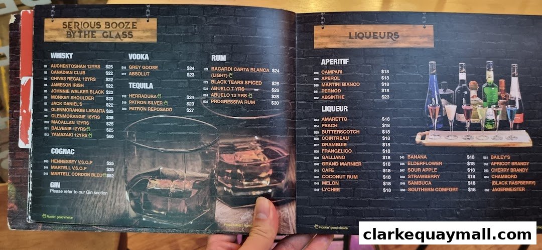 A menu featuring a wide selection of whiskies, vodkas, rums, cognacs, gins, liqueurs, and aperitifs.