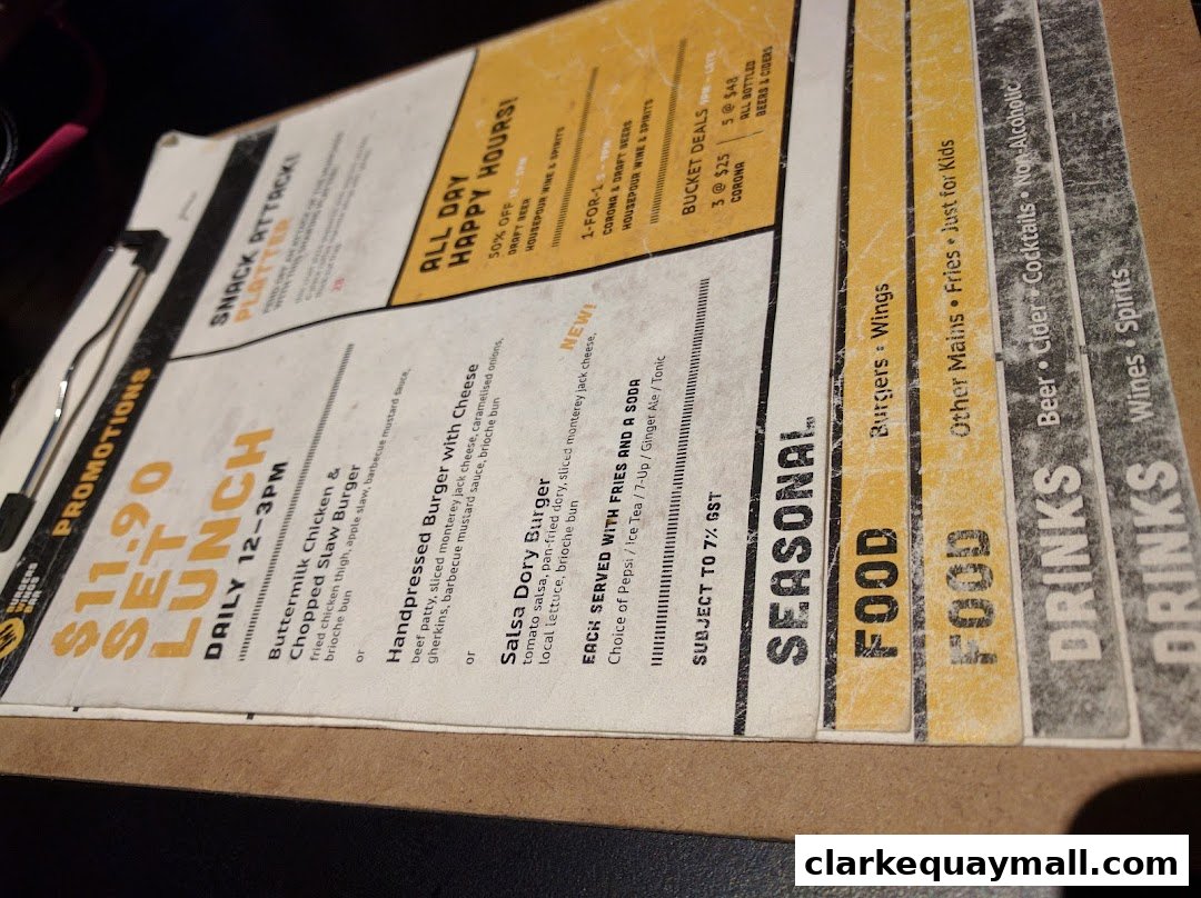 A menu from Wings Bar & Grill featuring lunch specials, happy hour deals, and food and drink categories.