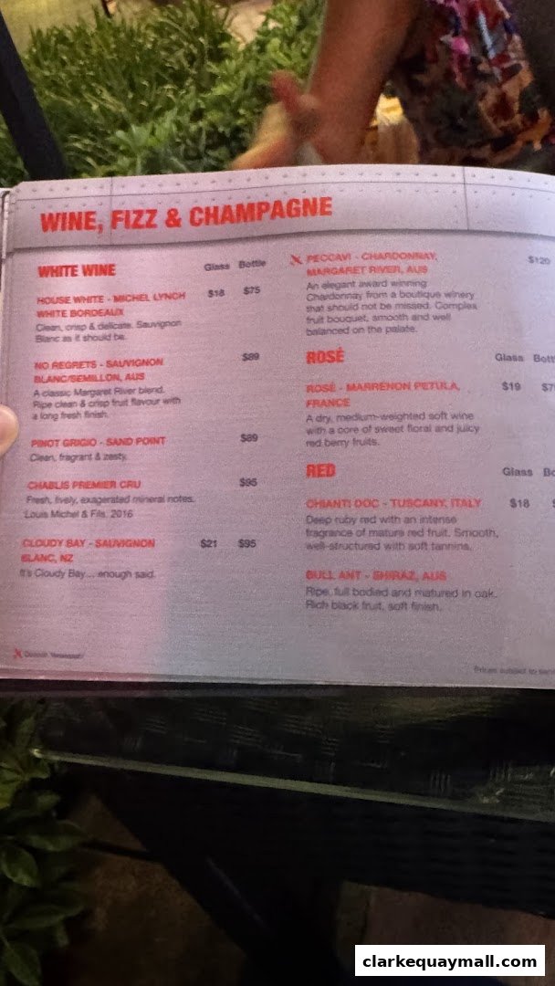 A menu page displaying a selection of white, rosé, and red wines with descriptions and prices.