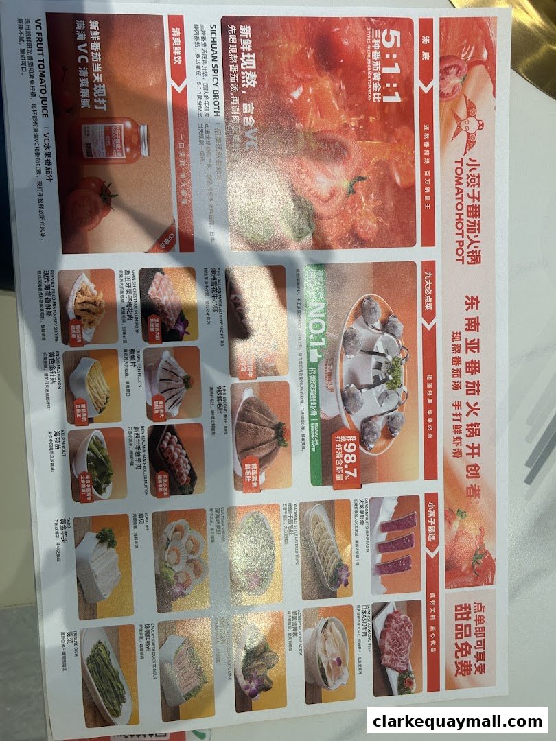 A menu for XiaoYanZi Tomato Hot Pot featuring various dishes and drinks.