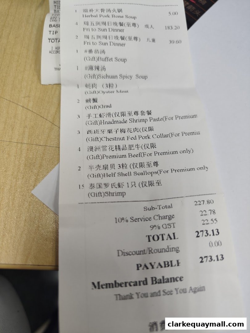 A receipt from XiaoYanZi Tomato Hot Pot showing various dishes and their prices.