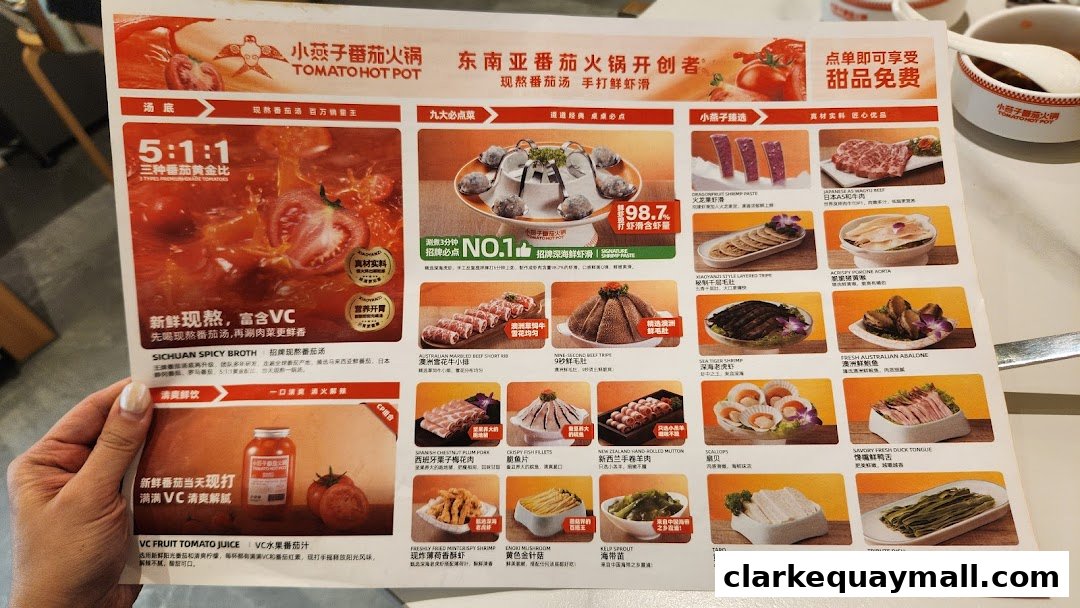 A menu from XiaoYanZi Tomato Hot Pot featuring various dishes and drinks.